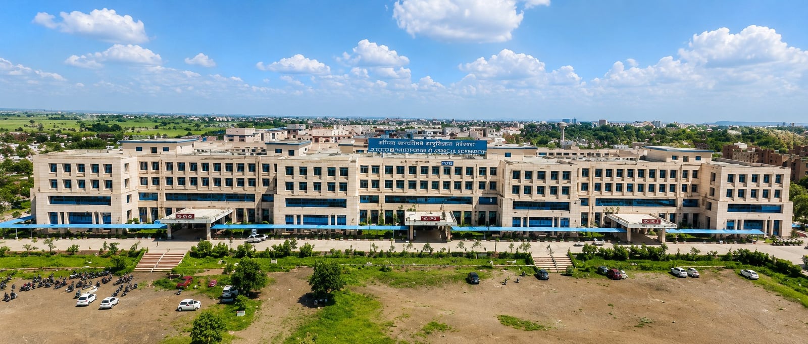 AIIMS Bhopal campus building beside the lake