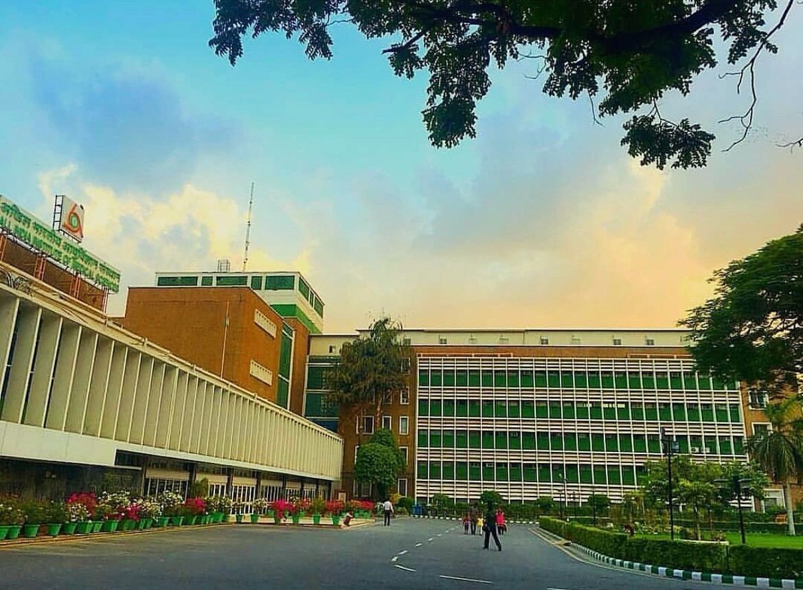 The institute's red-brick blocks at dusk