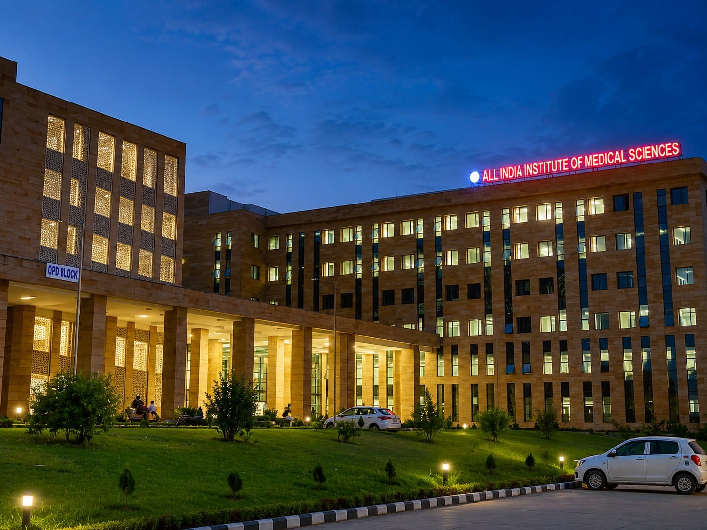 An AIIMS Kalyani building lit up at night