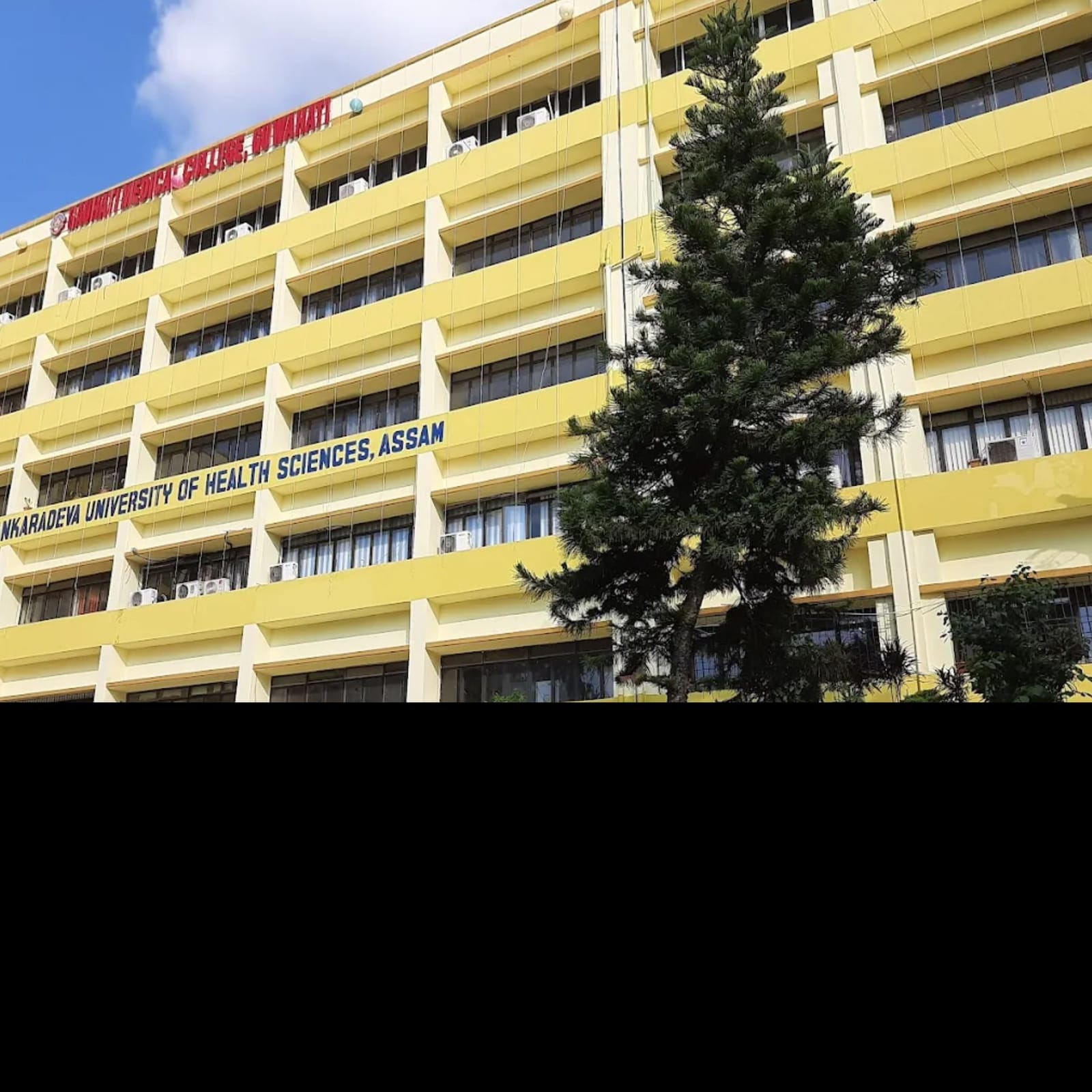 The main Gauhati Medical College building, Guwahati, with the college name banner