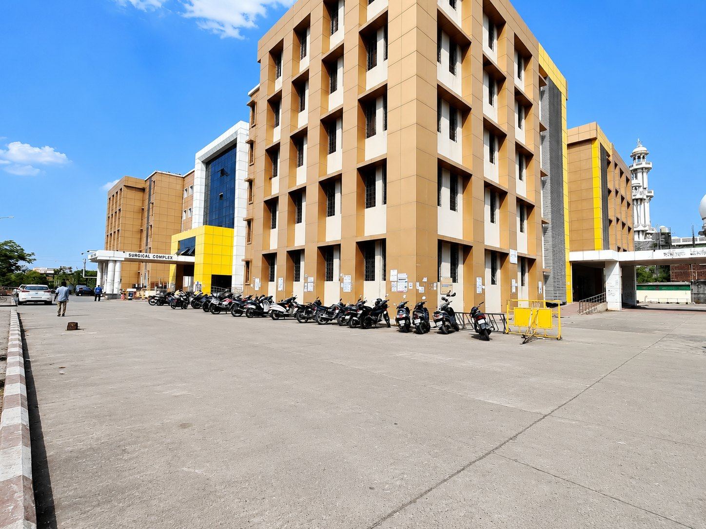 An IGGMC Nagpur college / hospital block with parked vehicles