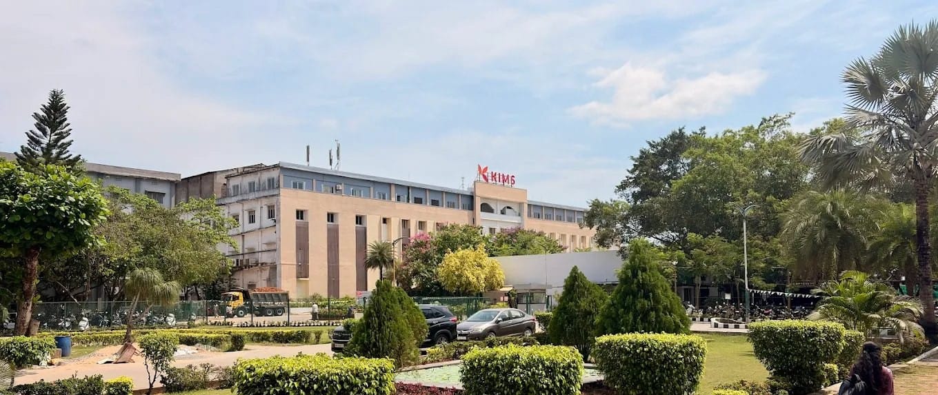 A KIMS academic block behind the landscaped campus, Amalapuram