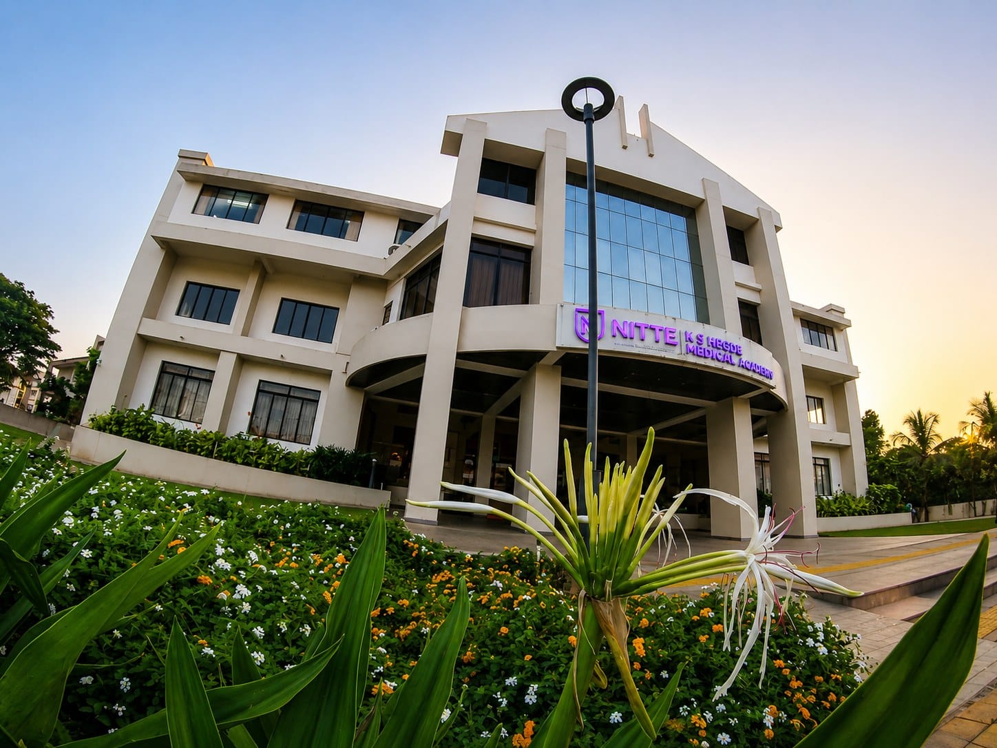 A KS Hegde Medical Academy building amid gardens, Mangalore