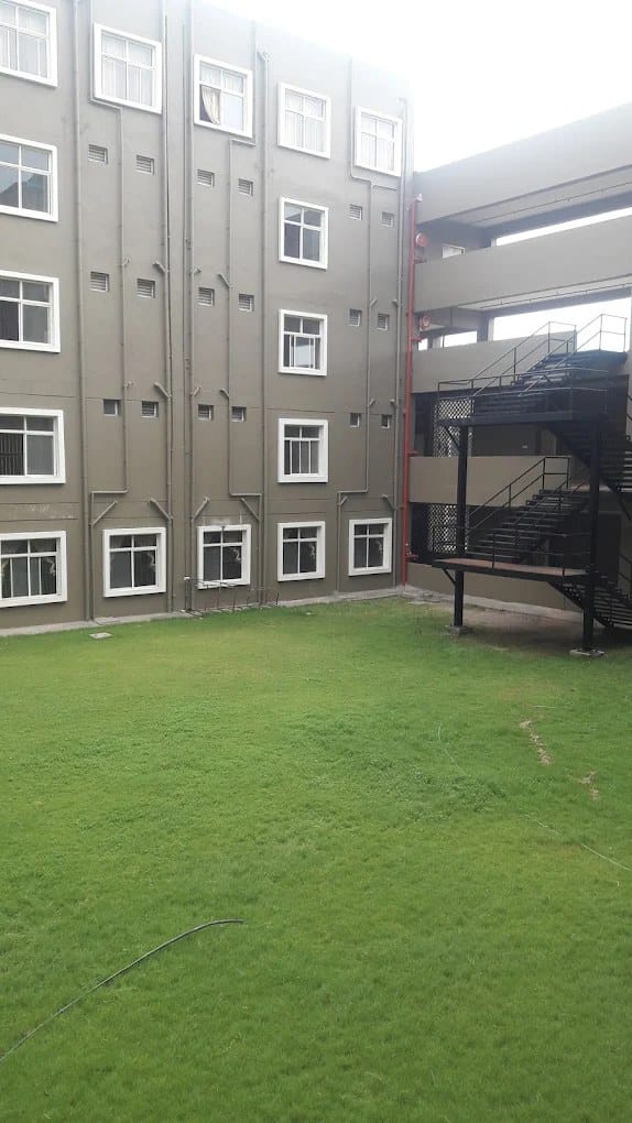 A campus courtyard and building at NRI Institute of Medical Sciences, Visakhapatnam
