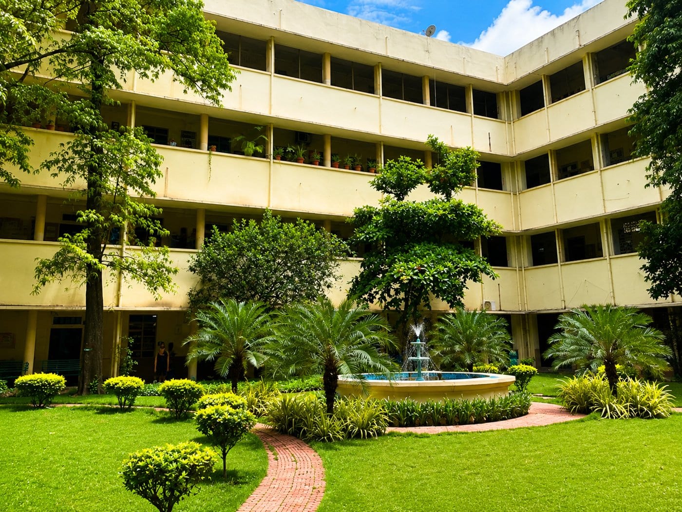 A landscaped courtyard with fountain at Osmania