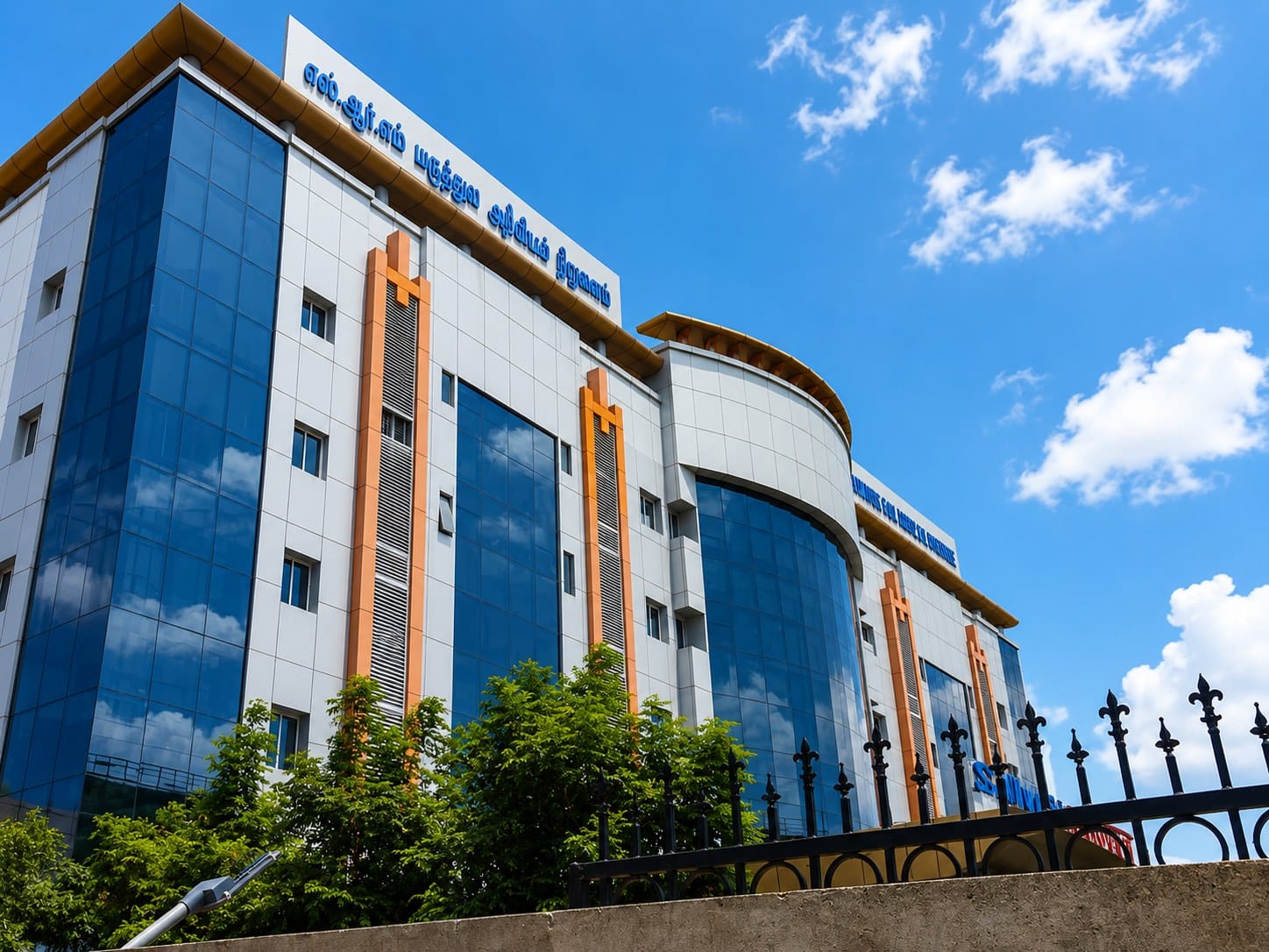 A blue-glass academic building at SRM Medical College, Chennai