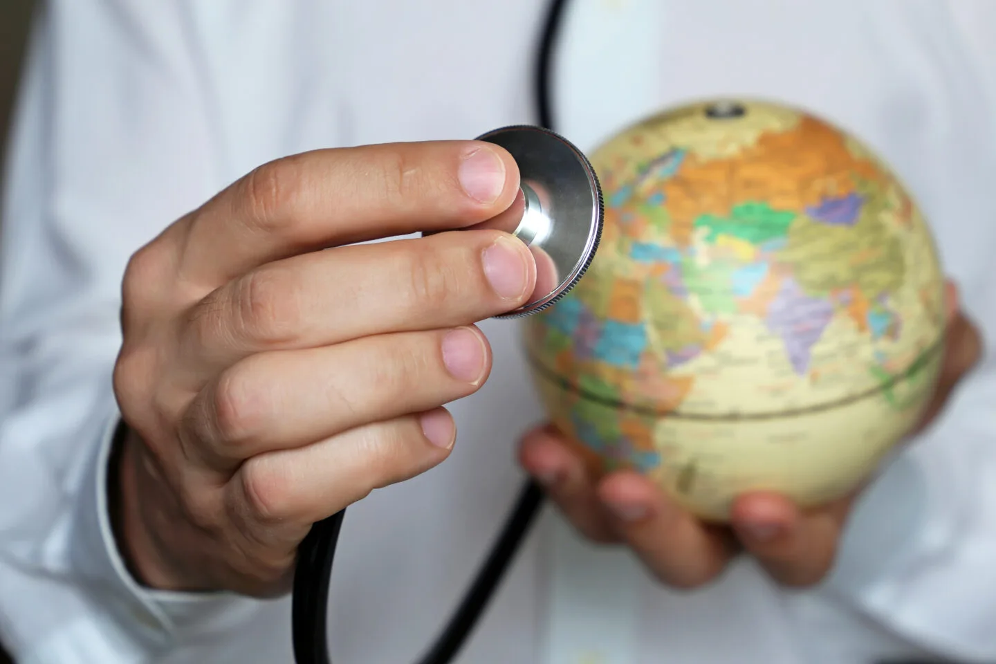 Doctor,With,Stethoscope,And,Globe,In,His,Hand.,Medical,Network to pursue in abroad to study medicine in - as a you can you will and medical